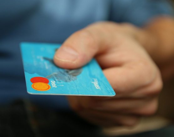 Person Holding Debit Card